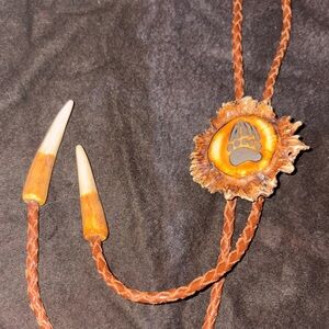 Horn Jewelry Brown and Tan Bolo Tie with Bear Paw Design